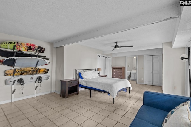 tiled bedroom featuring a textured ceiling and ceiling fan