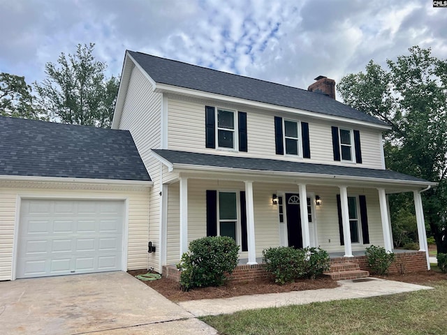 view of front of house featuring a garage and covered porch