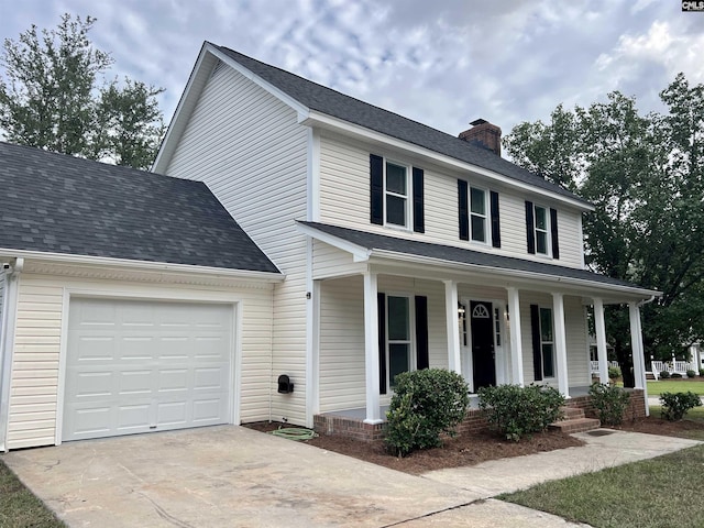 view of front facade featuring a garage and a porch