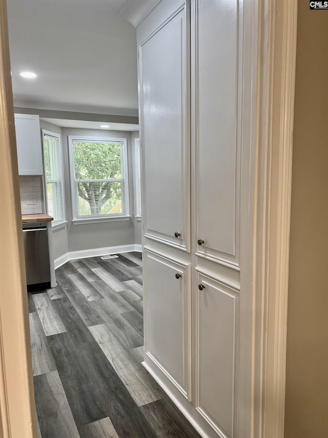 hallway featuring dark wood-type flooring