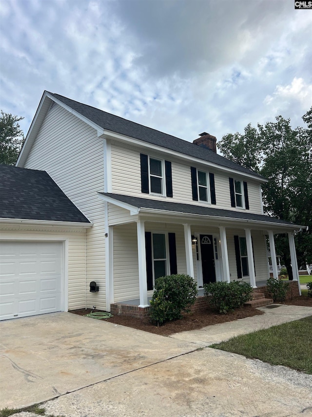 view of front of home featuring a garage and covered porch