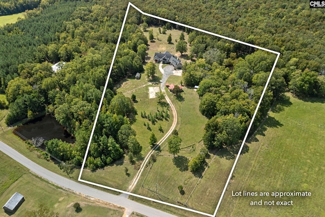 birds eye view of property with a rural view