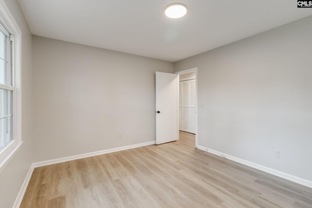 spare room featuring light hardwood / wood-style floors