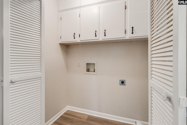 washroom featuring washer hookup, cabinets, hookup for an electric dryer, and hardwood / wood-style flooring