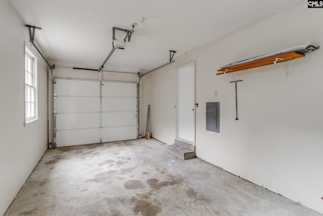 garage with electric panel and a garage door opener