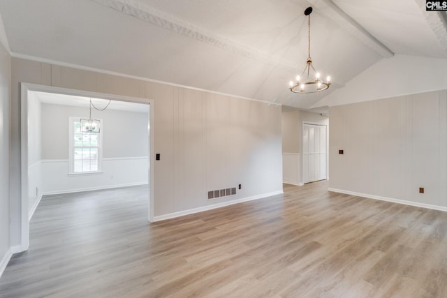 unfurnished room with a notable chandelier, lofted ceiling with beams, and hardwood / wood-style flooring