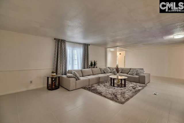 living room featuring a textured ceiling