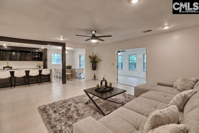 living room with ceiling fan