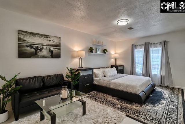 bedroom featuring a textured ceiling