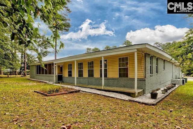 view of home's exterior with a yard