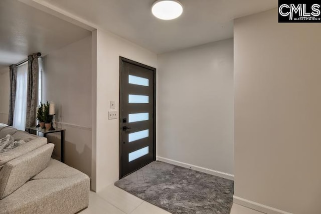 foyer entrance featuring tile patterned flooring