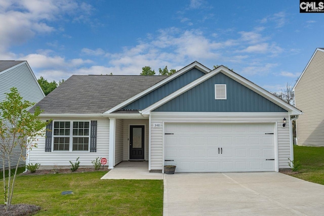 view of front of property with a front lawn and a garage