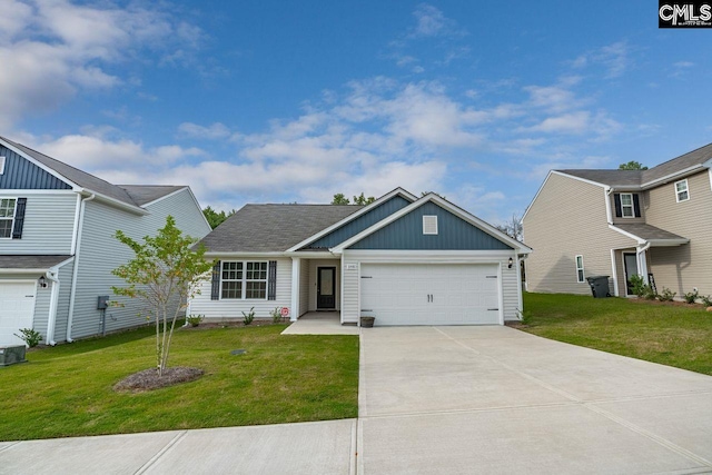 view of front facade with a garage and a front lawn