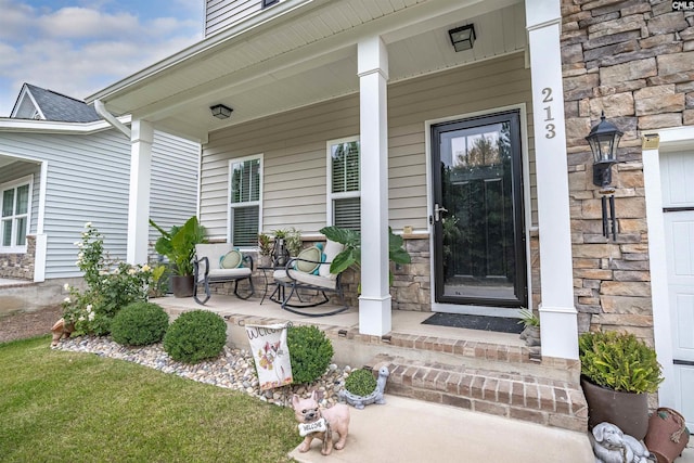 property entrance featuring a porch