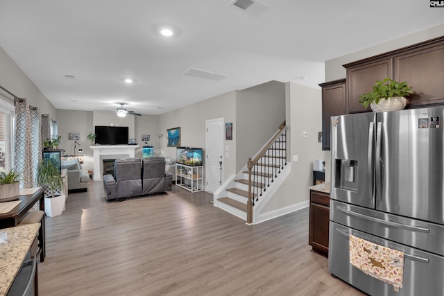 interior space with light hardwood / wood-style floors and ceiling fan