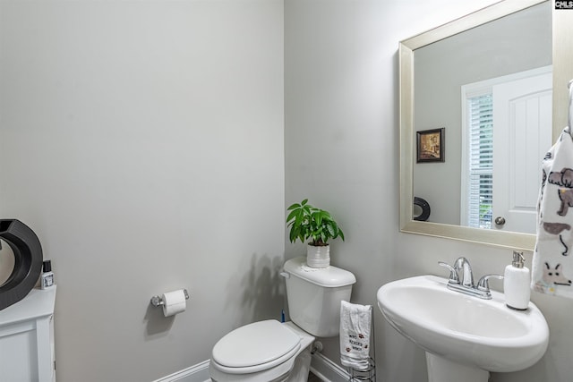 bathroom featuring sink and toilet