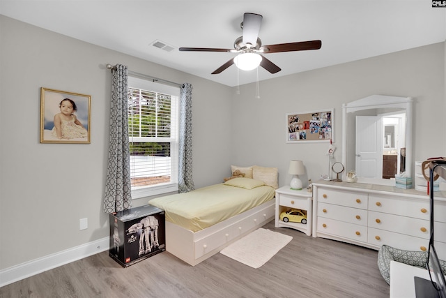 bedroom featuring light hardwood / wood-style floors and ceiling fan