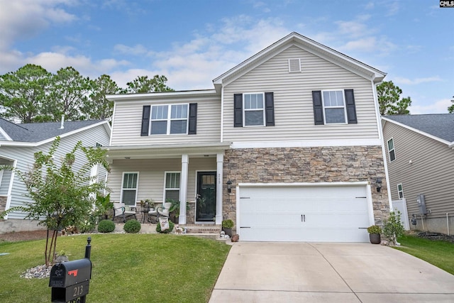 view of front facade with a front yard and a garage