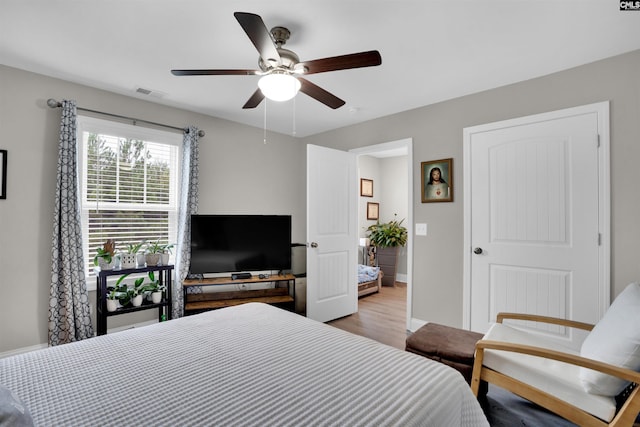 bedroom featuring light hardwood / wood-style floors and ceiling fan