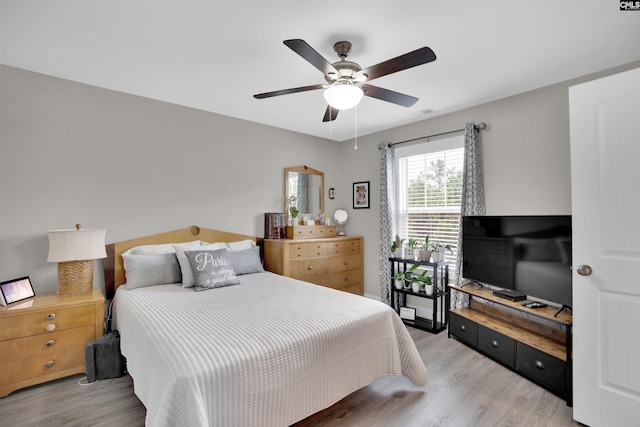 bedroom featuring ceiling fan and light hardwood / wood-style flooring