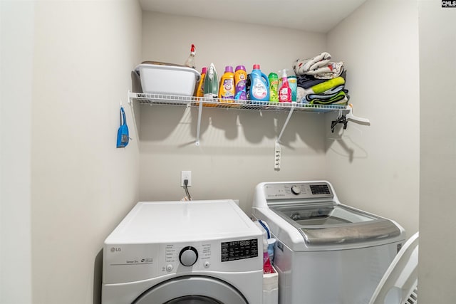 washroom featuring washer and dryer