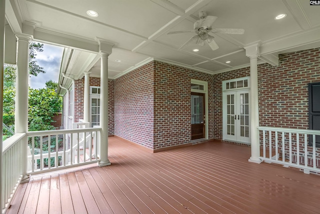 wooden deck featuring ceiling fan and french doors