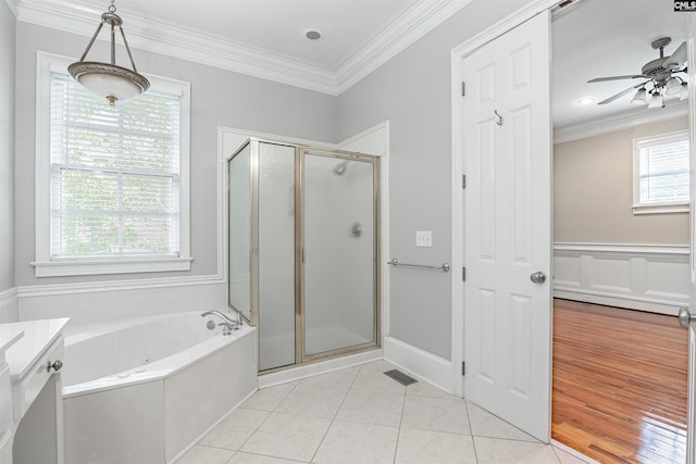 bathroom with a wealth of natural light, hardwood / wood-style floors, ceiling fan, and vanity