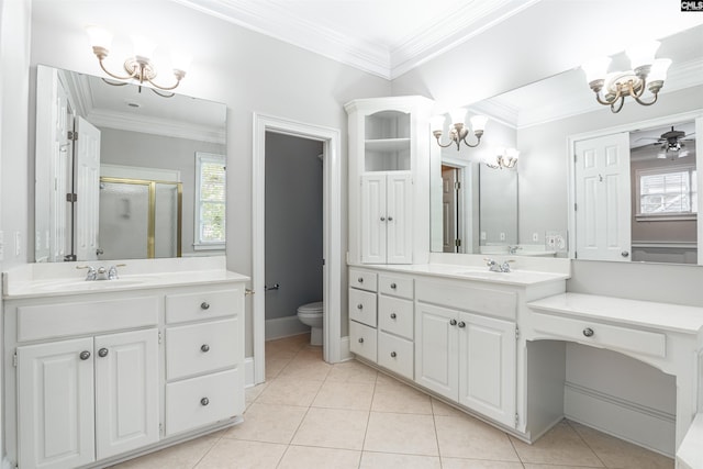 bathroom featuring vanity, ceiling fan with notable chandelier, a shower with shower door, and toilet