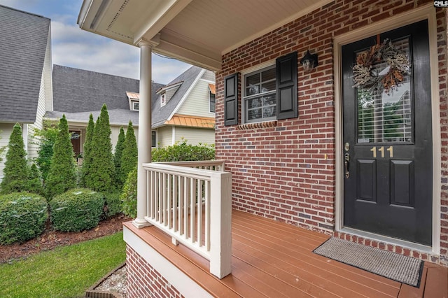 doorway to property with covered porch