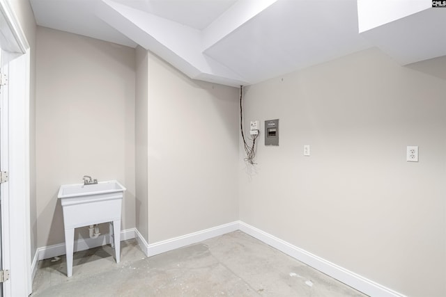 clothes washing area featuring electric panel