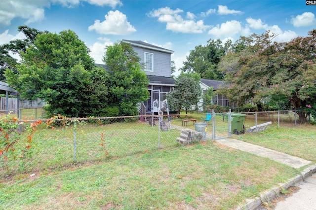 view of yard featuring a sunroom