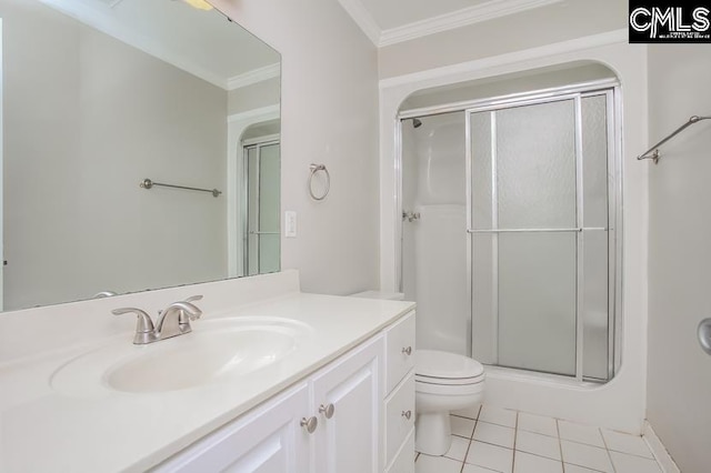 bathroom with a shower with shower door, vanity, crown molding, tile patterned flooring, and toilet