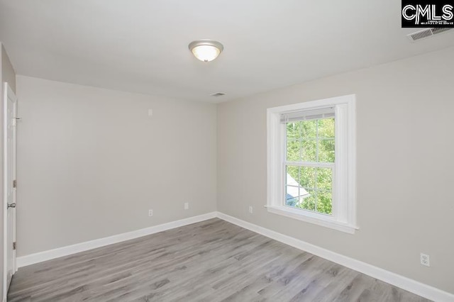 unfurnished room featuring light wood-type flooring