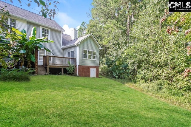 view of yard featuring a deck