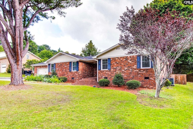 view of front of house featuring a garage and a front yard