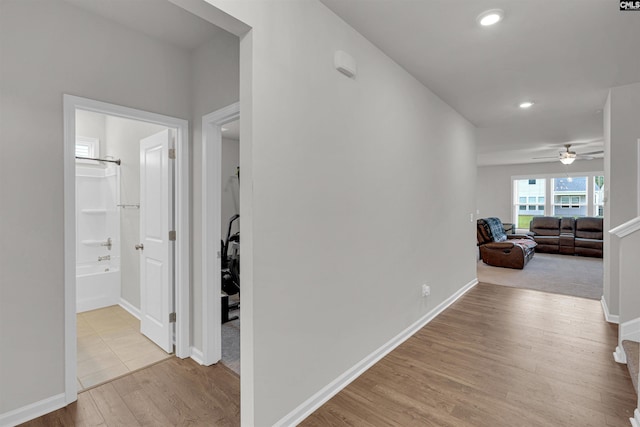 hall with light hardwood / wood-style floors