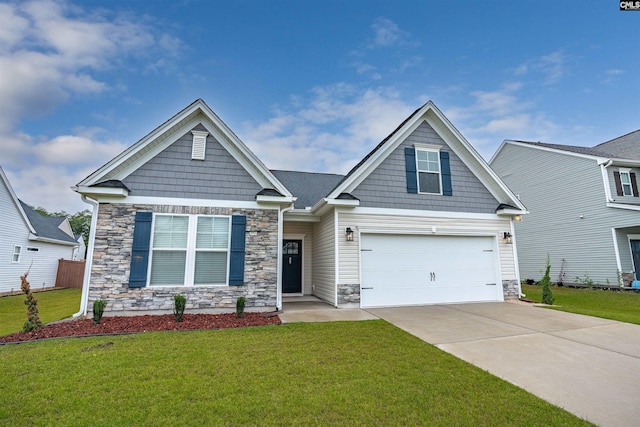 craftsman-style house featuring a front yard and a garage