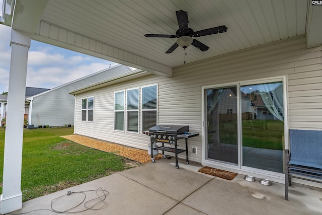 view of patio with ceiling fan and a grill