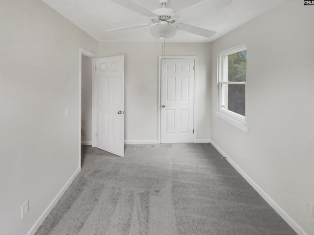 unfurnished bedroom with light carpet and ceiling fan