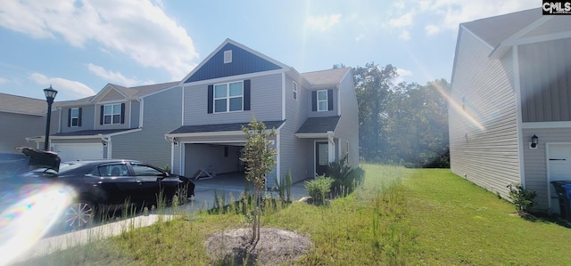 view of front of property with a garage and a front lawn