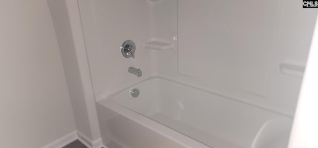 bathroom with shower / tub combination