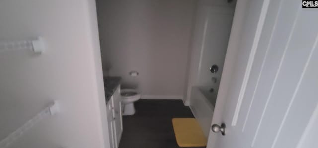 bathroom with tub / shower combination and toilet