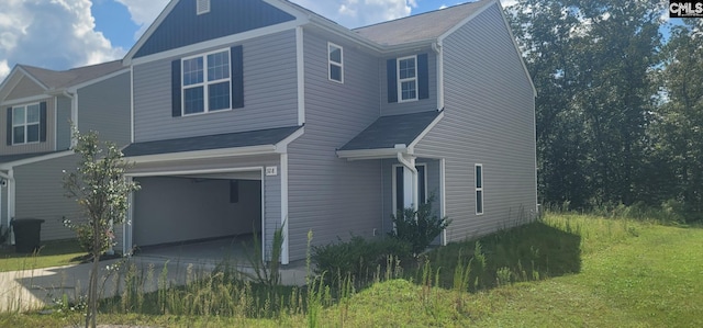 view of home's exterior featuring a yard and a garage