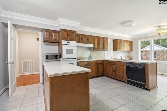 kitchen featuring ornamental molding, dishwasher, and ceiling fan