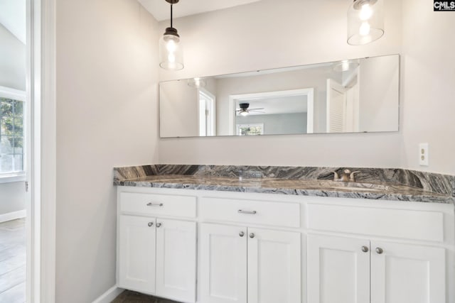 bathroom featuring vanity and ceiling fan