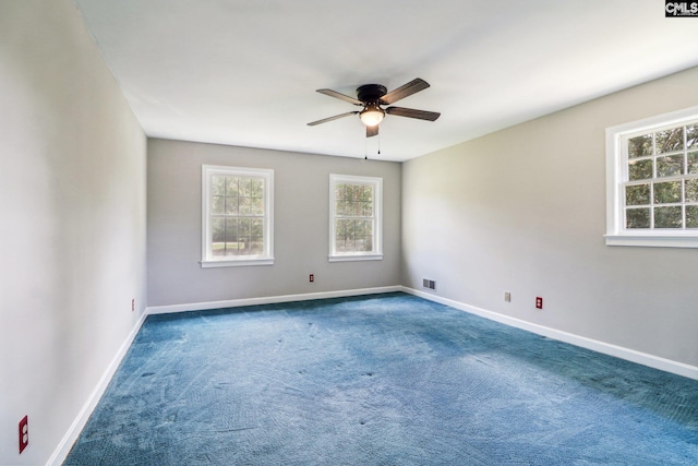 unfurnished room with carpet flooring and ceiling fan