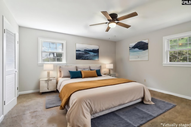 carpeted bedroom with ceiling fan