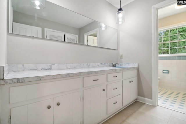 bathroom featuring tile patterned flooring and vanity