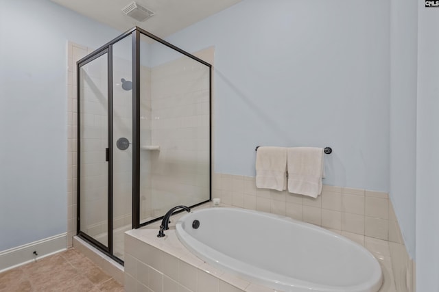 bathroom featuring separate shower and tub and tile patterned floors