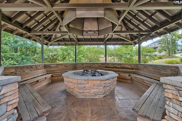 view of patio featuring a gazebo and an outdoor fire pit